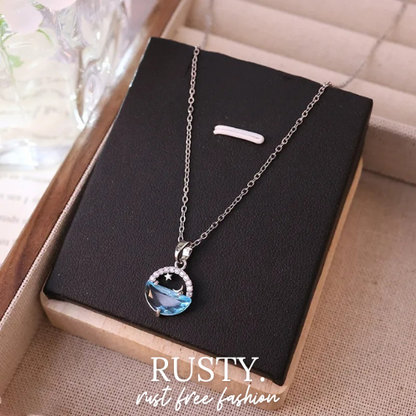 Moon & Ocean Wave Pendant Necklace – Silver-Tone Crystal Charm by Rusty