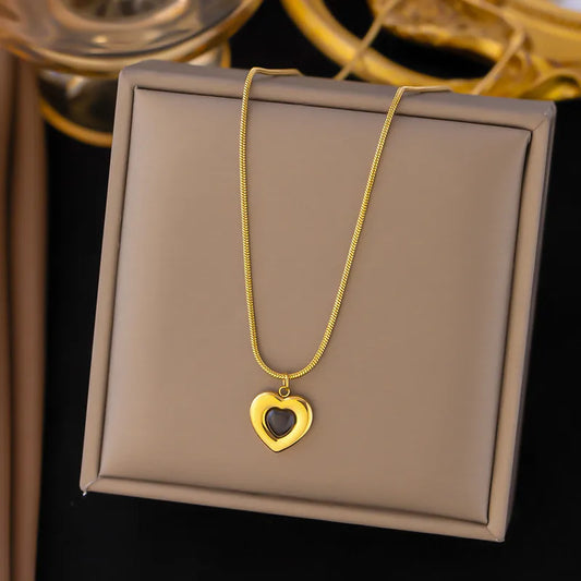 Golden Heart Pendant Necklace with Black Enamel – Rust-Free Fashion by Rusty