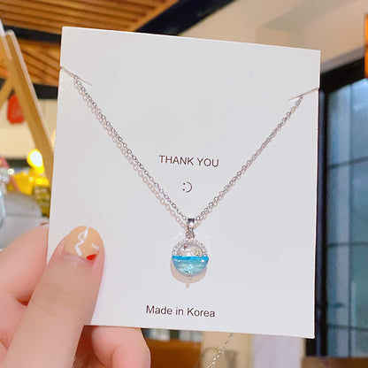 Moon & Ocean Wave Pendant Necklace – Silver-Tone Crystal Charm by Rusty