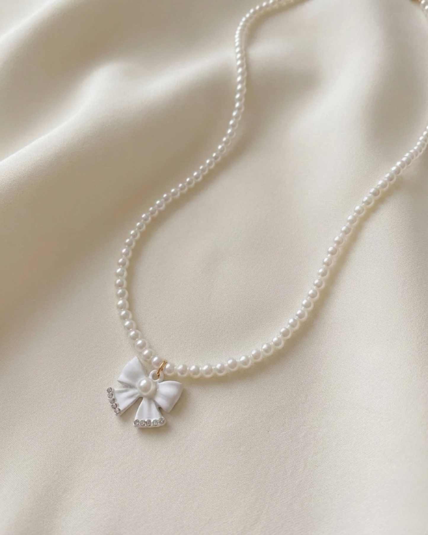 Rusty Pearl Bow Pendant Necklace