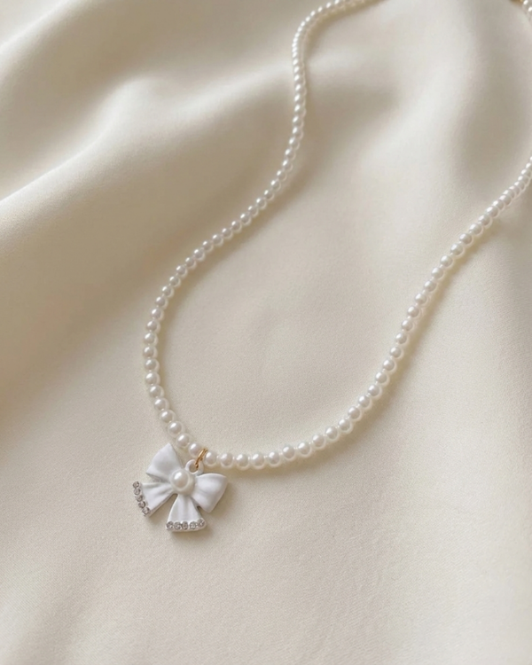 Rusty Pearl Bow Pendant Necklace