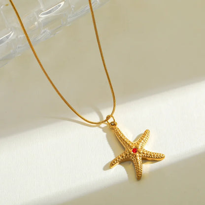 Gold Starfish Pendant Necklace with Blue Zircon – Ocean-Inspired Jewelry by Rusty