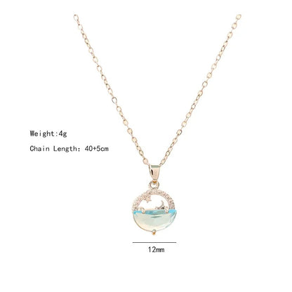 Moon & Ocean Wave Pendant Necklace – Silver-Tone Crystal Charm by Rusty