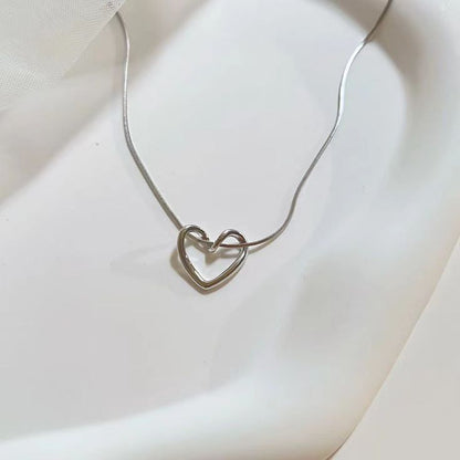 Minimalist Hollow Heart Pendant Necklace – Silver-Tone by Rusty