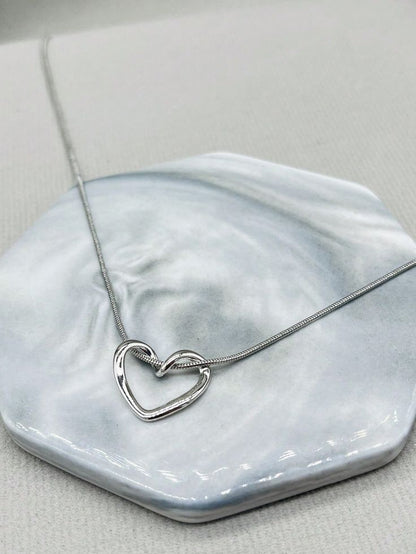 Minimalist Hollow Heart Pendant Necklace – Silver-Tone by Rusty